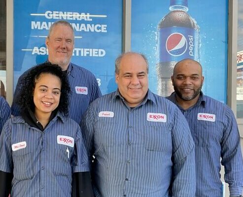 Group of mechanics smiling